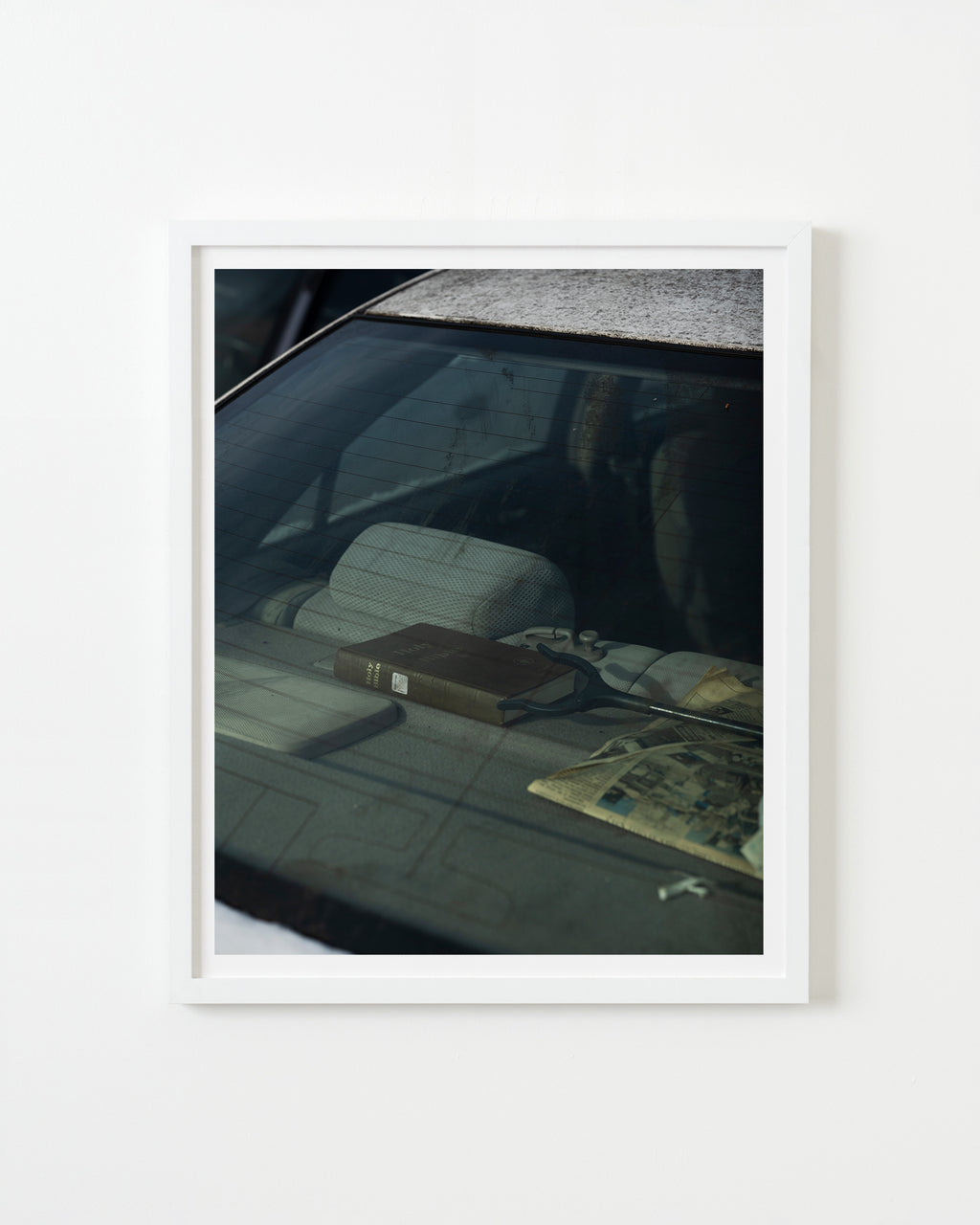 Photography by Nick Meyer titled "Backseat Bible" - 1.