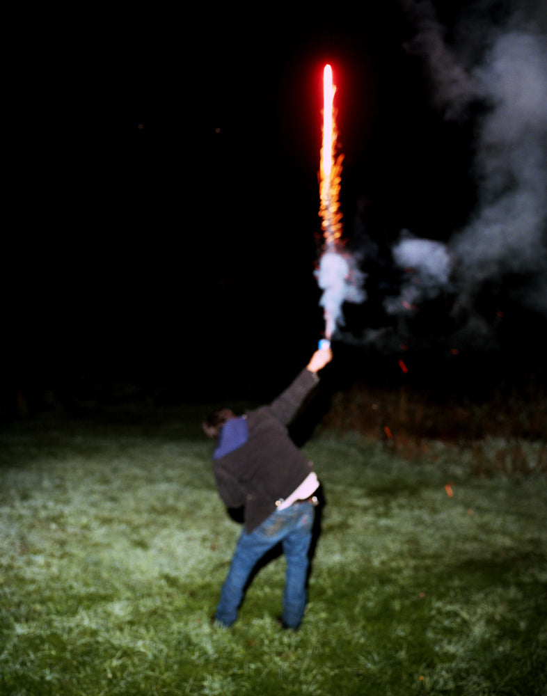 Photography by Nick Meyer titled "Manny Holding a Firework" - 2.