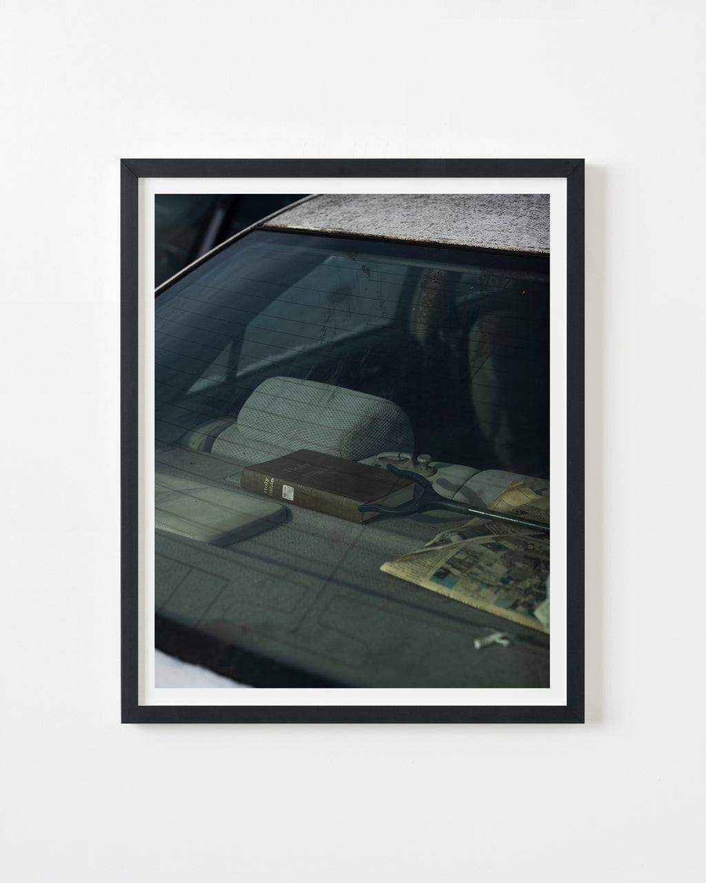 Photography by Nick Meyer titled "Backseat Bible" - 3.