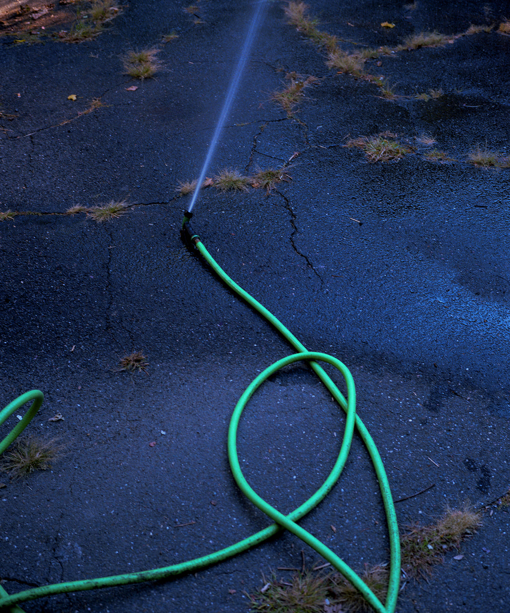 Photography by Nick Meyer titled "Running Hose" - 2.